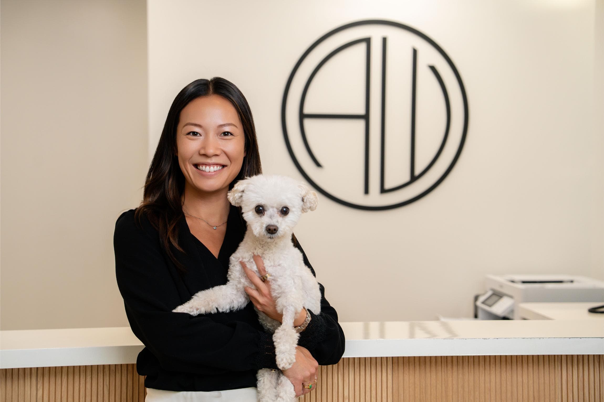 Dr. Ariel Wong of AW Orthodontics with dog, providing orthodontist care in Lebanon and Zionsville.