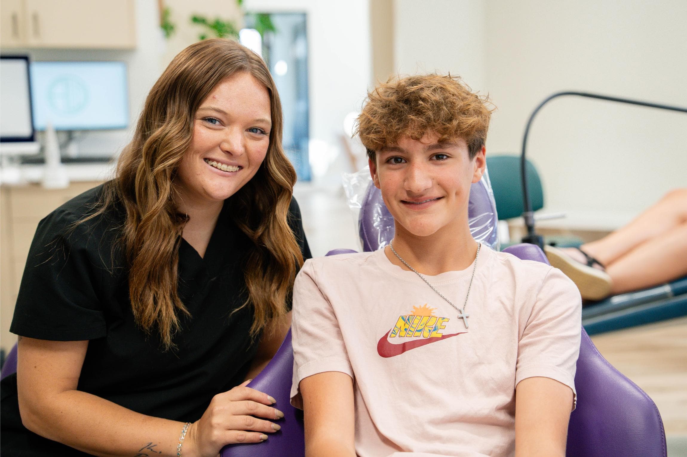 teen patient and team member smiling