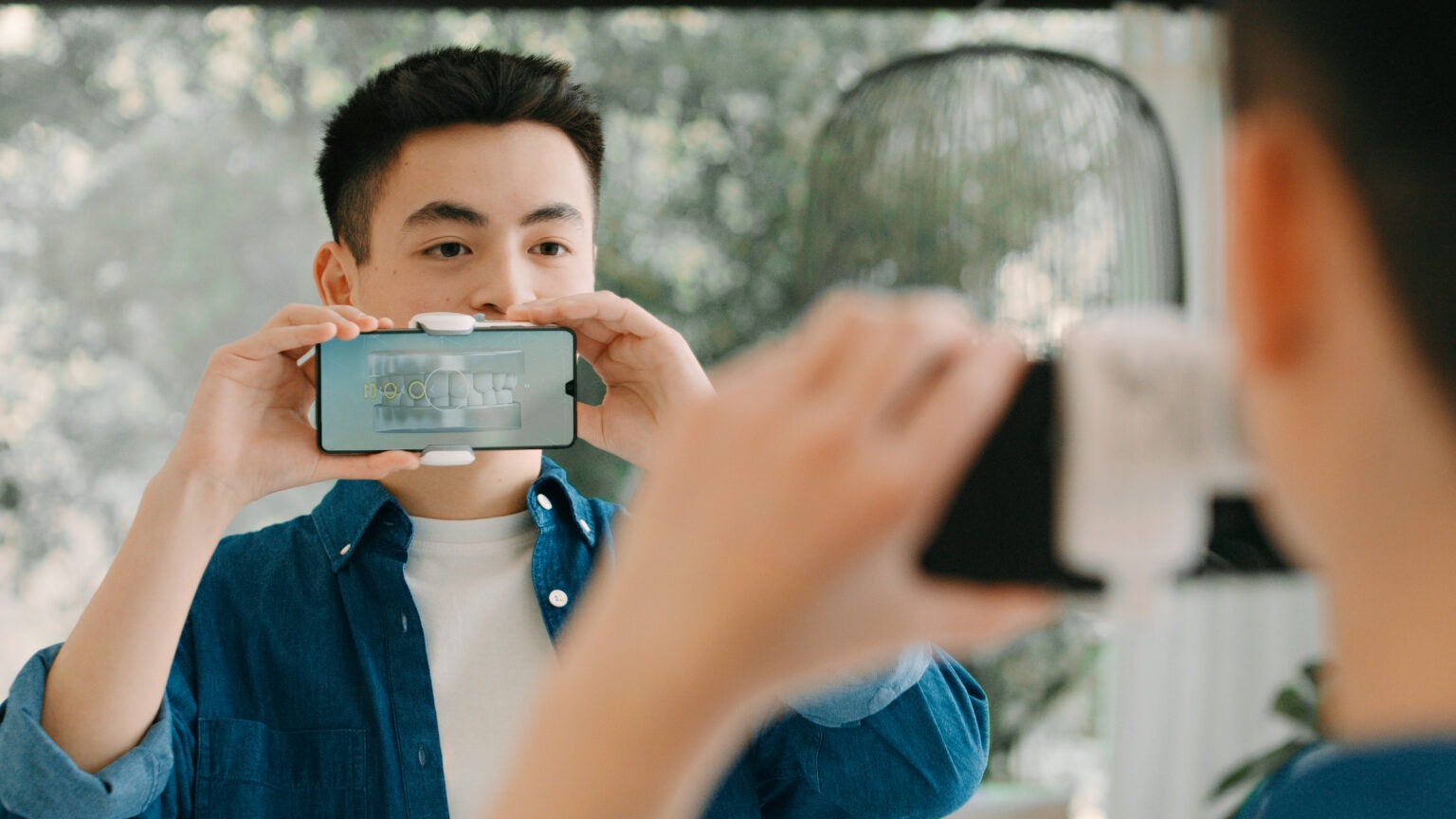 patient using dental monitoring app at aw orthodontics